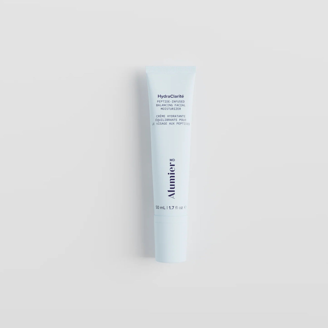 A 30 mL white squeeze tube of Alumier HydroClarite Hydrating Balancing Moisturizer, centered on a light gray background.