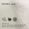 Thumbnail for Product packaging with 'MOMO/' branding and sensory description of fig, citrus, and cedarwood.