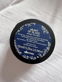 Thumbnail for Davines 'Heart of Glass' hair treatment container on a white towel