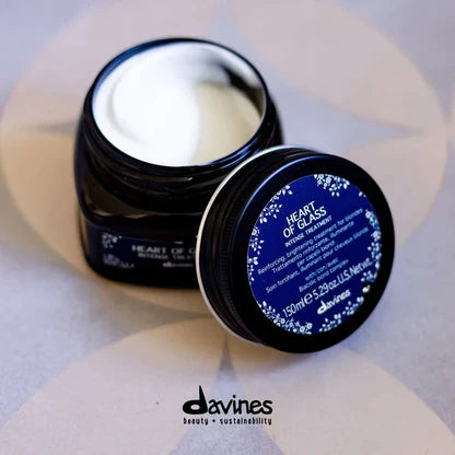 Davines hair product jar with blue label on a light background