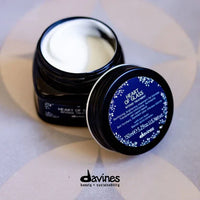 Thumbnail for Davines hair product jar with blue label on a light background