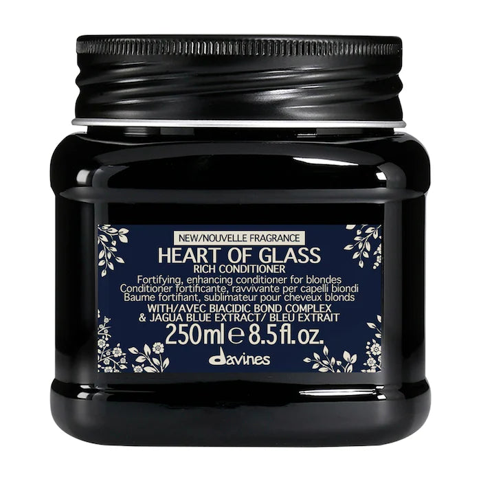 Davines Heart of Glass Rich Conditioner in a 250ml black jar with a black ribbed lid and a navy blue label with white text and floral accents.