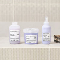 Thumbnail for Three Davines hair care products on a bathroom shelf with a tiled wall background.