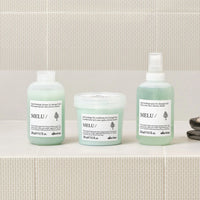 Thumbnail for Three bottles of Melu hair care products on a bathroom counter.