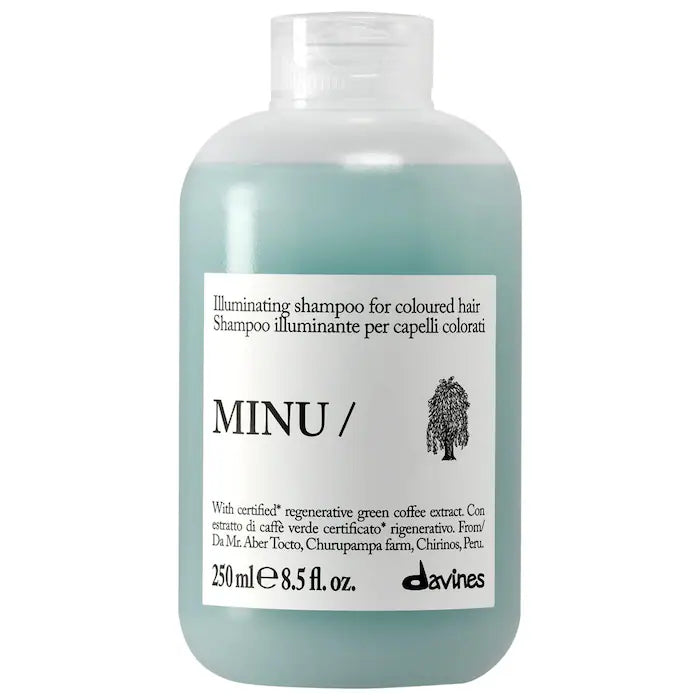 A 250 ml bottle of Davines MINU Illuminating shampoo for coloured hair, featuring a translucent pale green bottle and a white label with black text.