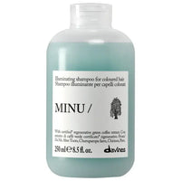 Thumbnail for A 250 ml bottle of Davines MINU Illuminating shampoo for coloured hair, featuring a translucent pale green bottle and a white label with black text.