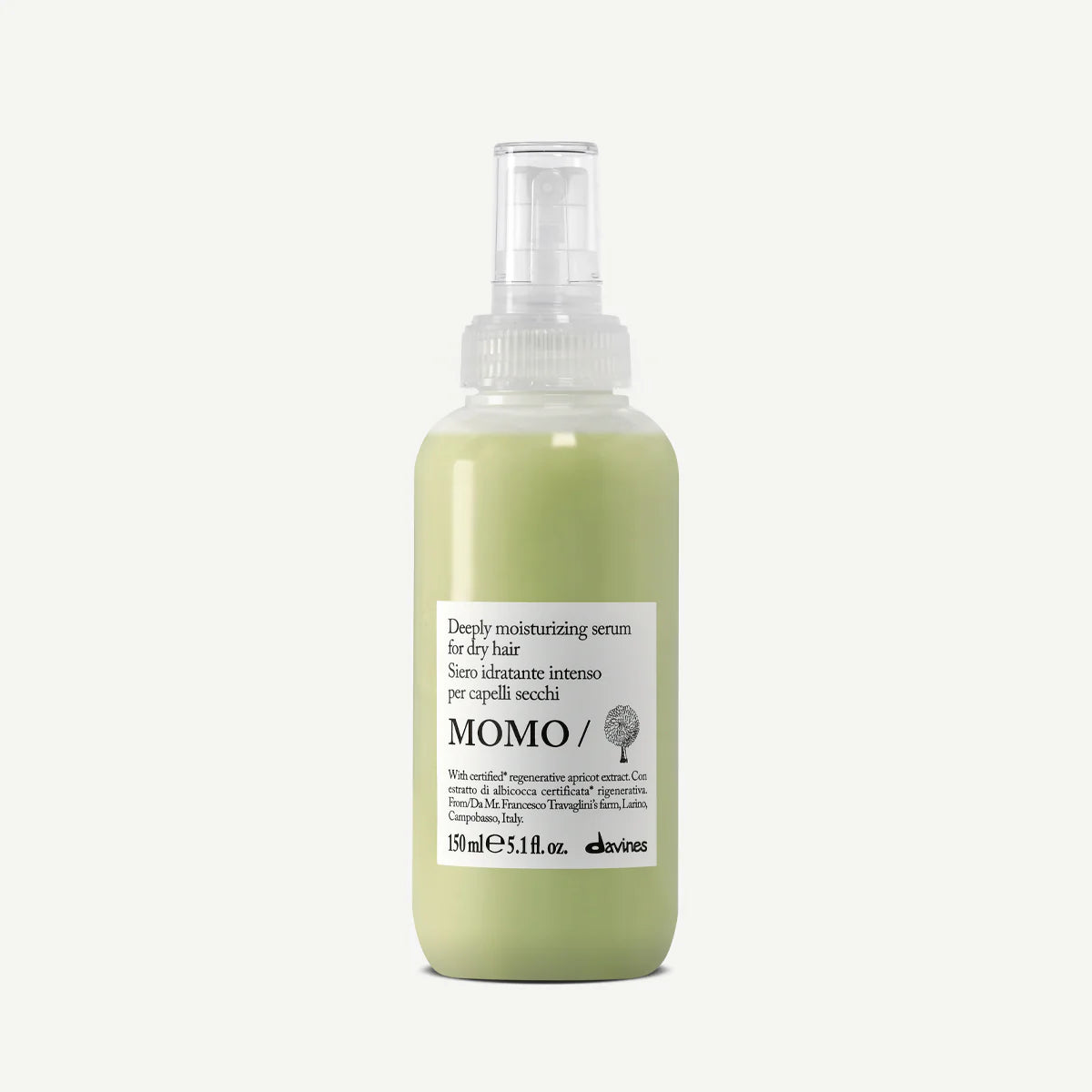 Bottle of Momo hair serum on a white background
