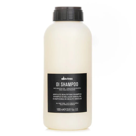 A 1000 ml bottle of Devines Oi Shampoo with a black cap and a black label, shown on a plain white background.