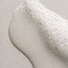 Thumbnail for Close-up of a white liquid droplet on a textured surface