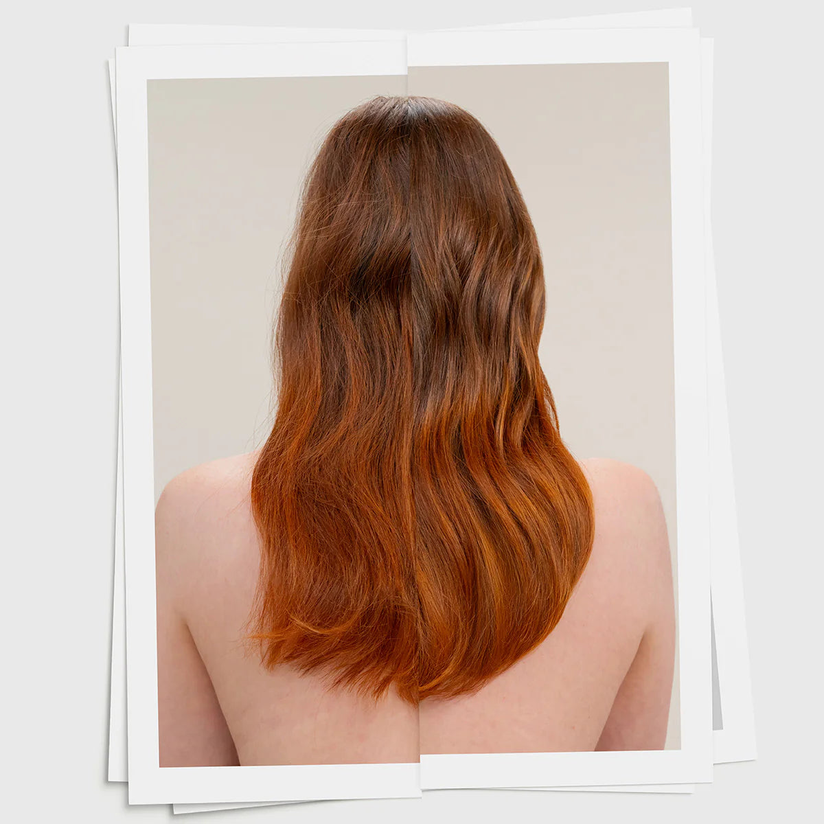 Long, wavy hair with a gradient color on a neutral background