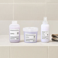 Thumbnail for Three Davines hair care products on a bathroom shelf with a tiled wall background.
