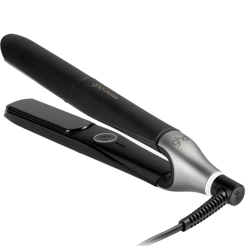 Black and silver hair straightener on a white background