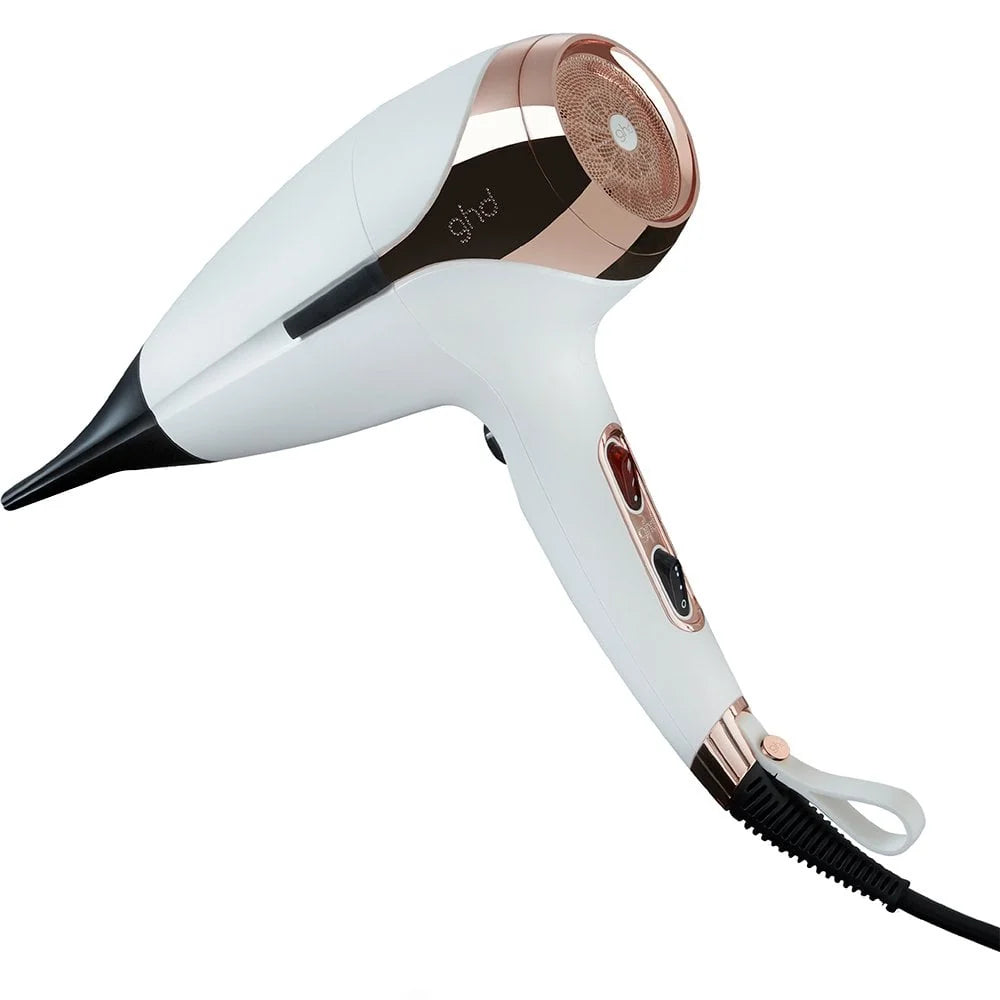 White and rose gold hair dryer on a white background