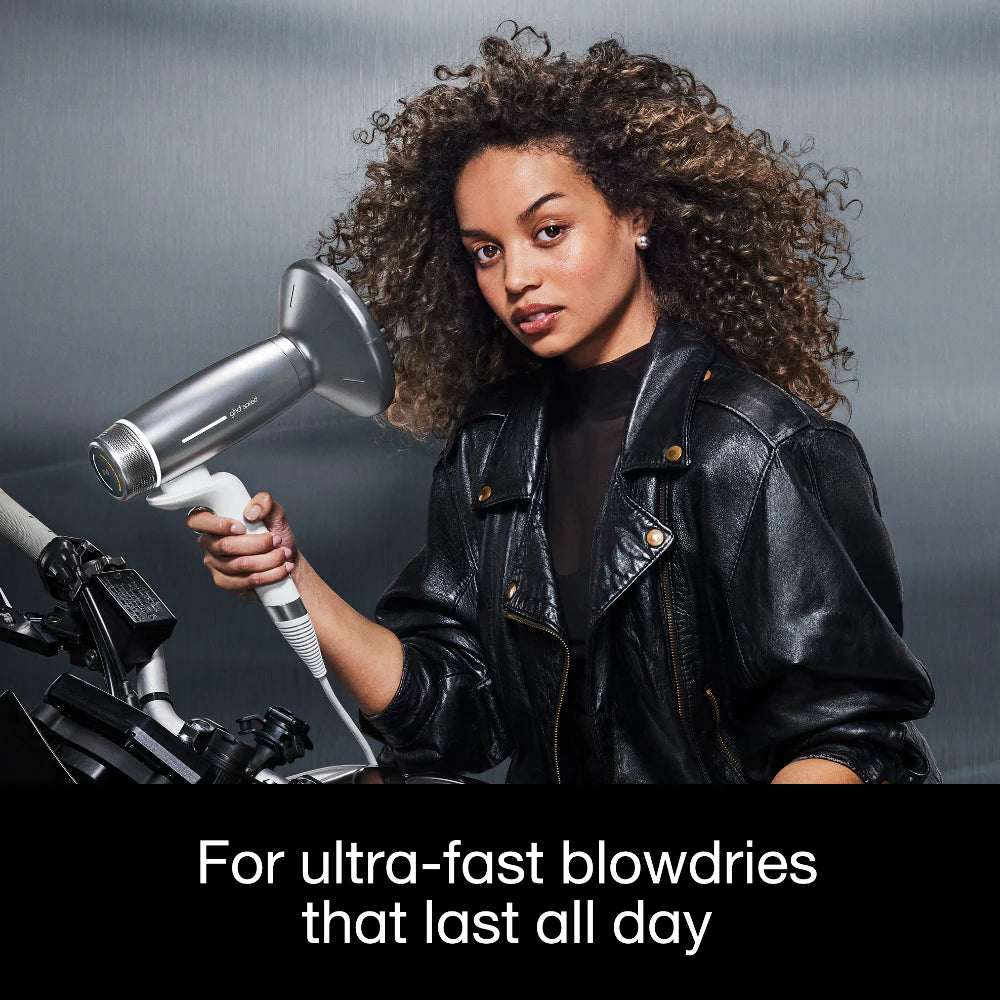 Woman holding a hair dryer with text about ultra-fast blowdries.
