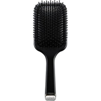 Thumbnail for A black paddle hairbrush with flexible bristles and a silver metal accent at the base of the handle, shown against a plain white background.