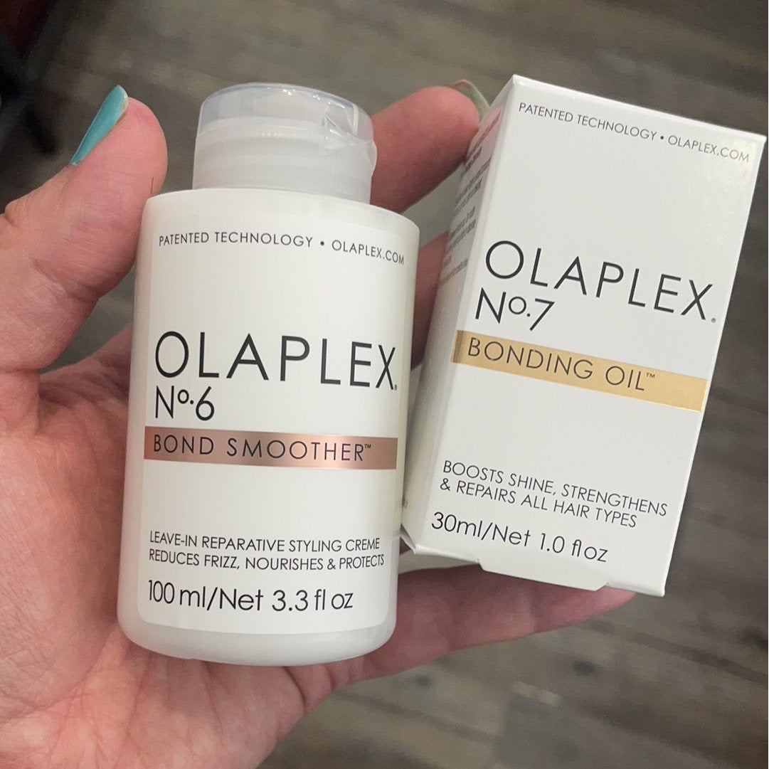 Two bottles of Olaplex hair care products, with the Bond Smoother in a white pump bottle and the Bonding Oil in a white and gold box.